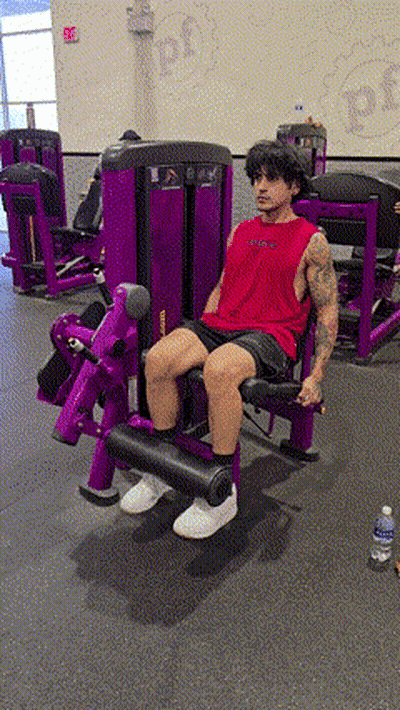 Man In Red Tank Top On Purple Machine GIF
