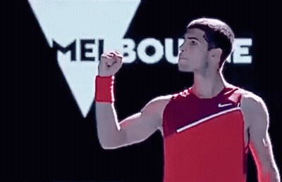 Man In Red Tank Top Raising Fist Melbourne Sign GIF