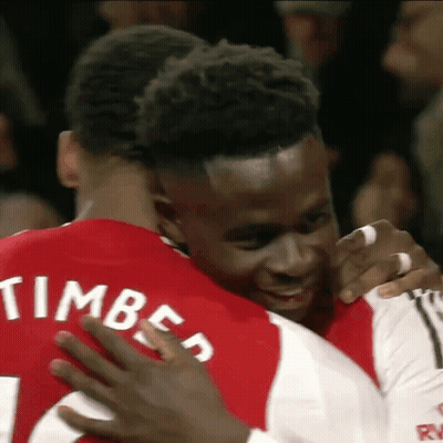 Man In Red Timber Shirt Hugging Another Man GIF