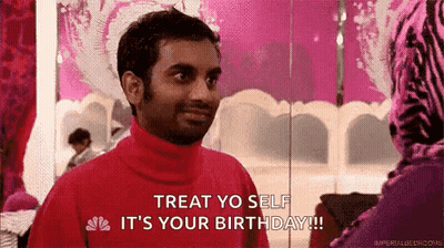 Man In Red Turtleneck Talking To Woman In Pink Zebra Dress GIF