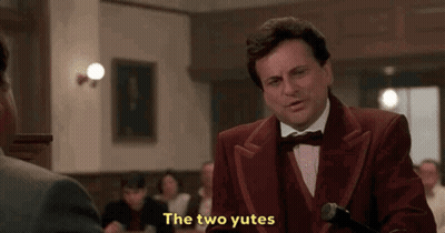 Man In Red Tuxedo Talking To Another Man In Restaurant GIF