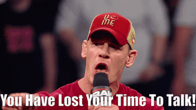 Man In Red U.S. Me Hat Talking Into Microphone Saying You Have Lost Your Time To Talk GIF