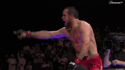 Man In Red UFC Shorts Standing In Front Of Crowd GIF