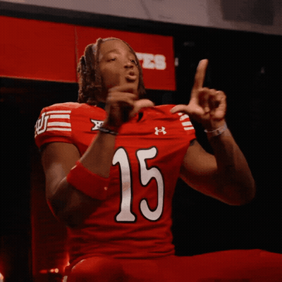 Man In Red Under Armour Jersey Number 15 GIF