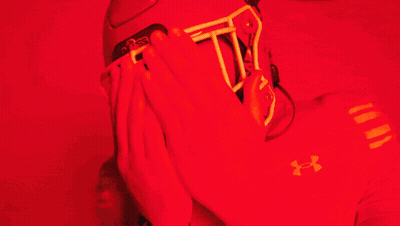 Man In Red Under Armour Shirt Covering Face GIF