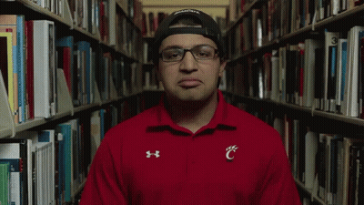 Man In Red Under Armour Shirt With C On Chest GIF