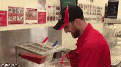Man In Red Uniform Cooking GIF