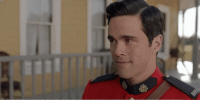 Man In Red Uniform Standing On Porch GIF