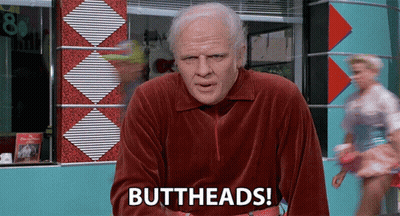 Man In Red Velvet Shirt Says Buttheads In Front Of Diner GIF