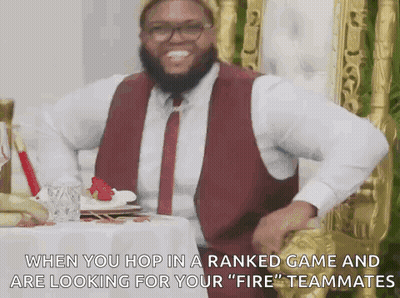 Man In Red Vest And Tie At Table GIF