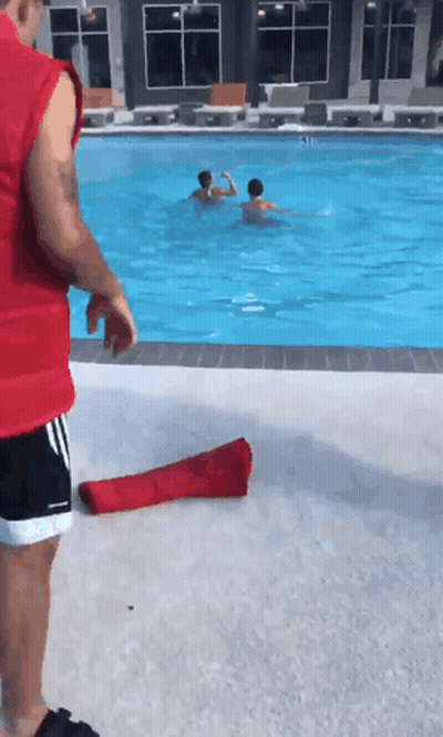 Man In Red Vest Next To Pool GIF