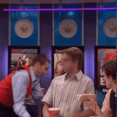 Man In Red Vest Talking GIF
