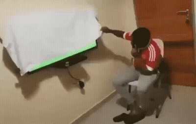 Man In Red White Adidas Shirt Watching TV GIF