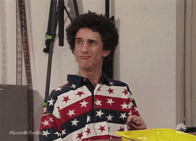 Man In Red White Blue Star Shirt Holding Yellow Tray GIF