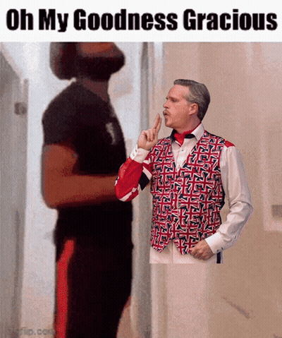 Man In Red White Blue Vest Shushing GIF