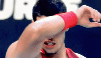 Man In Red Wristband Covering Face GIF