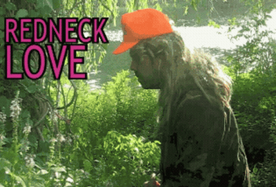 Man in Redneck Hat in Woods Near River
