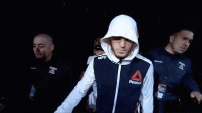 Man in Reebok Jacket Walks Through Crowd