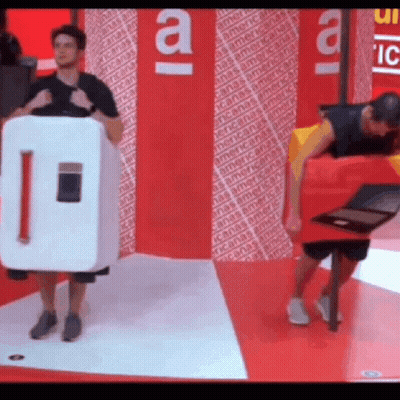 Man In Refrigerator Costume Standing Next To Another Man GIF