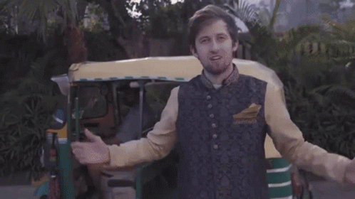 Man In Rickshaw Giving Peace Sign GIF