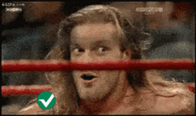 Man In Ring With Green Check Mark On Shoulder GIF