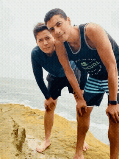 Man In Rip Curl Shirt Next To Another Man GIF