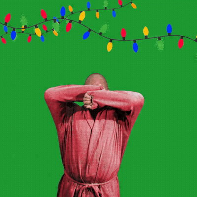 Man In Robe Flexing With Christmas Lights Yawn GIF