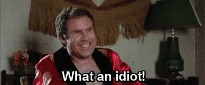 Man In Robe Sitting In Chair Smiling GIF