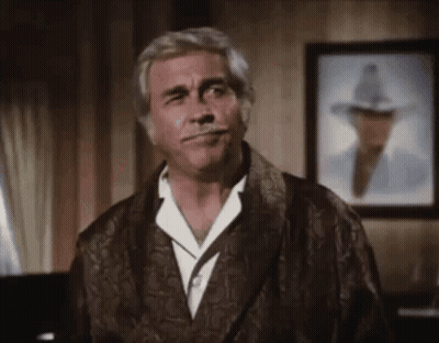 Man In Robe Standing Before Man In Hat GIF