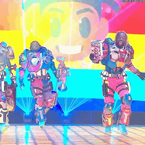 Man In Robot Costume Holding Trophy GIF
