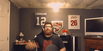 Man In Room With Cunningham Sign GIF