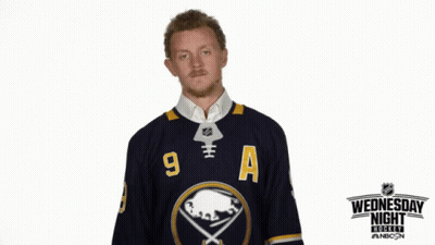 Man In Sabres Jersey In Front Of Wednesday Night Hockey Sign GIF