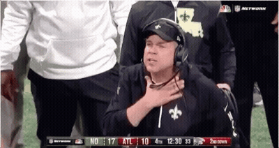 Man In Saints Hat And Headphones On Football Field GIF
