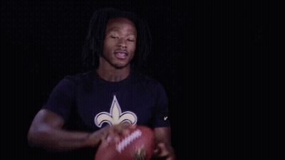 Man In Saints Shirt Holding Football GIF