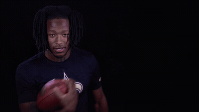 Man In Saints Shirt Holding Football GIF