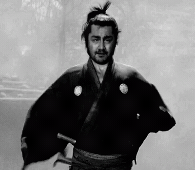 Man In Samurai Costume Holding Sword Black And White GIF