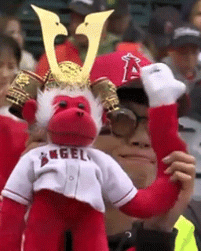 Man In Samurai Hat With Stuffed Monkey Saying Angels GIF