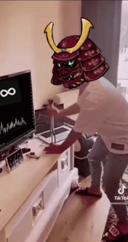 Man In Samurai Helmet In Front Of Computer Monitor GIF