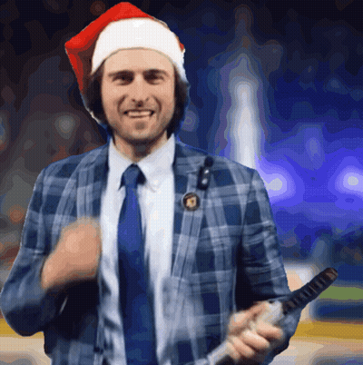 Man In Santa Hat And Plaid Suit Holding Microphone GIF