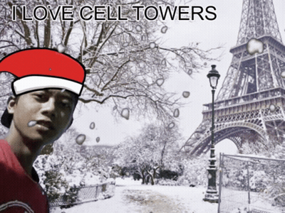 Man In Santa Hat At Snowy Eiffel Tower GIF