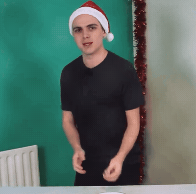 Man In Santa Hat Dancing GIF