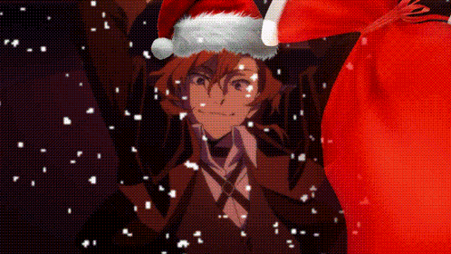 Man In Santa Hat Holding Red Bag In Snow GIF