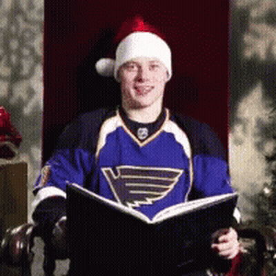 Man In Santa Hat Reading Book GIF
