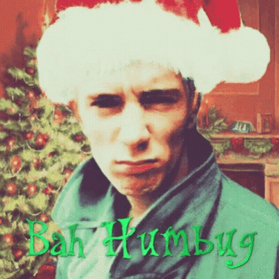 Man in Santa Hat Saying Bah Humbug