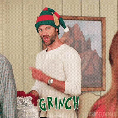 Man In Santa Hat Says Grinch GIF