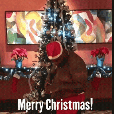 Man in Santa Hat Wishing Merry Christmas