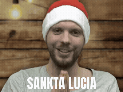 Man In Santa Hat With Sankta Lucia GIF