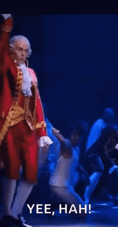 Man In Santa Suit Dancing On Stage GIF