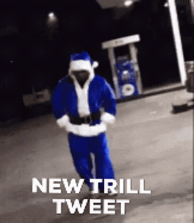 Man In Santa Suit Walking Past Gas Pump Saying New Trill Tweet GIF