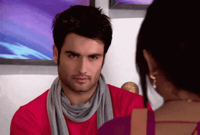 Man In Scarf And Red Shirt Looking At Woman GIF
